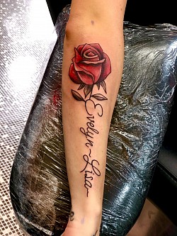 Rose with name in stem tattoo