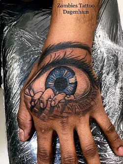 Hand in eye tattoo zombies tattoo studio dagenham